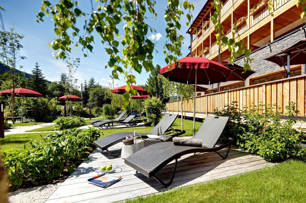 Hotel Monika Sexten Esterno foto The garden of the hotel